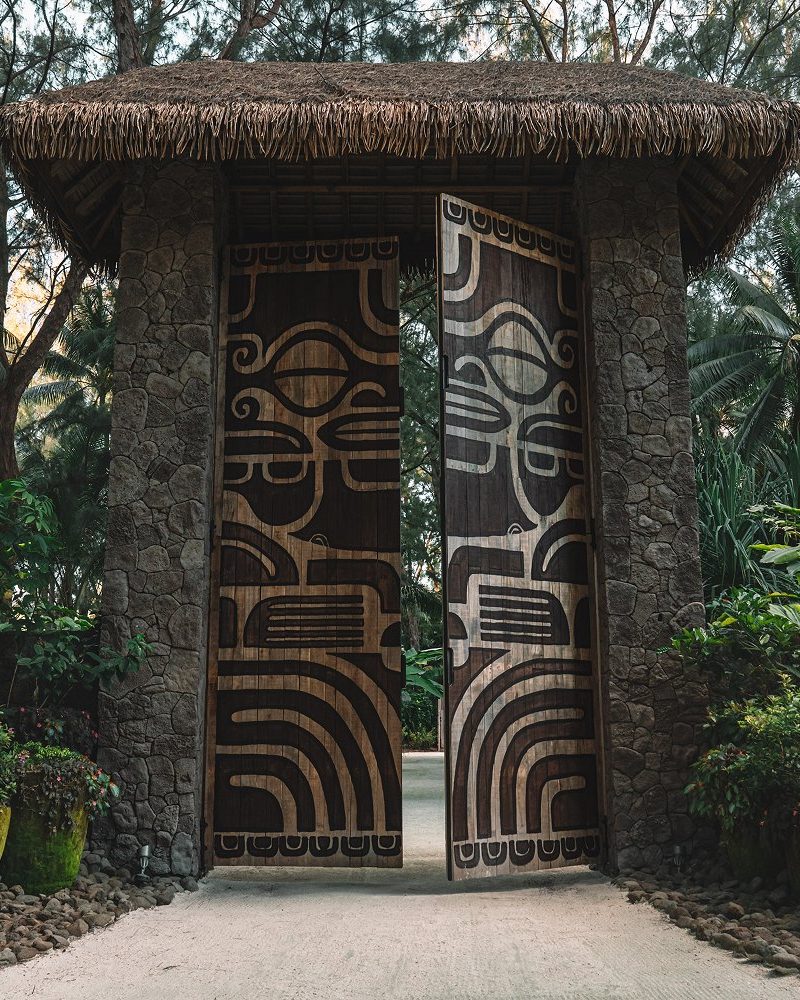 Carved gateway with Polynesian motifs